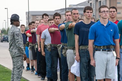 Tech. Sgt. Edroy Robinson, 331st Training Squadron military training instructor, provides instructions to newly arrived Air Force basic trainees May 20, 2015, at Joint Base San Antonio-Lackland, Texas. Military training instructors are vital to maintaining the world’s greatest Air Force. In 7 ½ weeks, MTIs transform America’s sons and daughters from civilians into Airmen by instilling discipline, attention to detail, esprit de corps and challenging them physically and mentally. (U.S. Air Force photo by Johnny Saldivar/released)