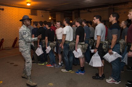 Tech. Sgt. Jarmaine Thomas, 331st Training Squadron military training instructor, yells instructions to newly arrived Air Force basic trainees May 20, 2015, at Joint Base San Antonio-Lackland, Texas.  Military training instructors are vital to maintaining the world’s greatest Air Force. In 7 ½ weeks, MTIs transform America’s sons and daughters from civilians into Airmen by instilling discipline, attention to detail, esprit de corps and challenging them physically and mentally. (U.S. Air Force photo by Johnny Saldivar/released)