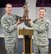 Lt. Gen. Stanley E. Clarke III, Air National Guard director, presents Senior Master Sgt. Thomas W. Egstad, 115th Fighter Wing occupational safety and health manager, with the ANG Director of Safety Outstanding Achievement Award at Volk Field Air National Guard Base, May6. (Submitted Photo)