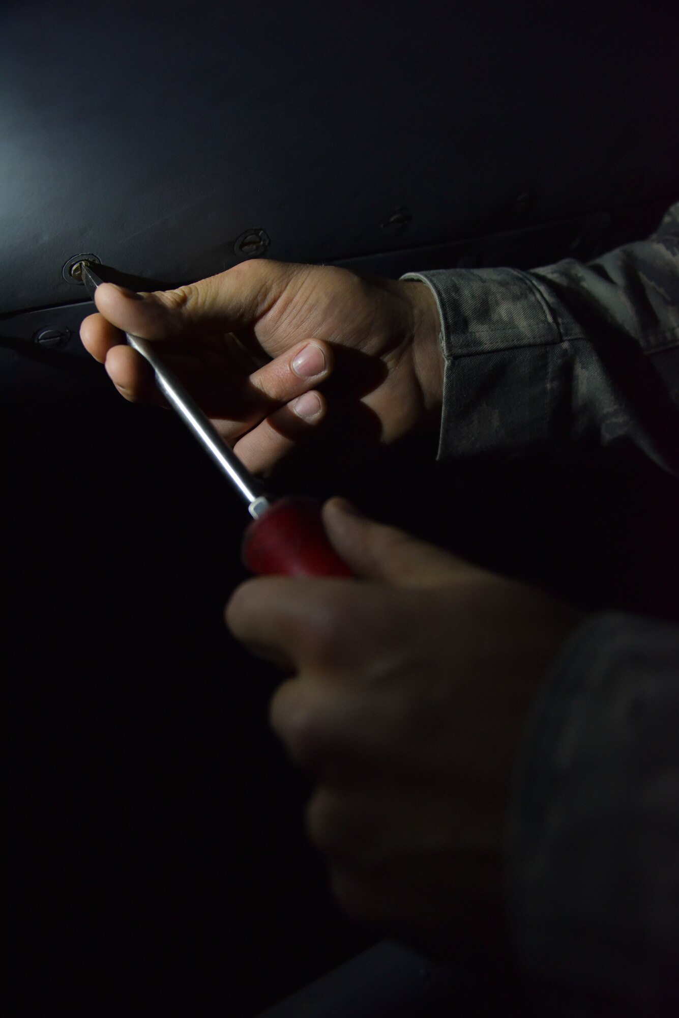 Senior Airman Jacob Francis, 911th Aircraft Maintenance Squadron crew chief, closes an engine panel during a post flight inspection here, May 21, 2015. The panel protects the working parts of the engine from water damage and corrosion while at the same time assists with the aerodynamics of the aircraft. (U.S. Air Force photo by Senior Airman Joshua J. Seybert)