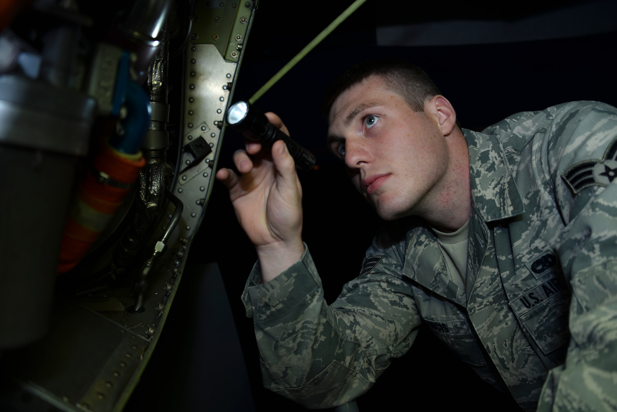 Senior Airman Jacob Francis, 911th Aircraft Maintenance Squadron crew chief, inspects hoses for leaks during a post flight inspection here, May 21, 2015. Post flight inspections are performed after every flight ensuring aircraft parts weren’t damaged during the flight. (U.S. Air Force photo by Senior Airman Joshua J. Seybert)
