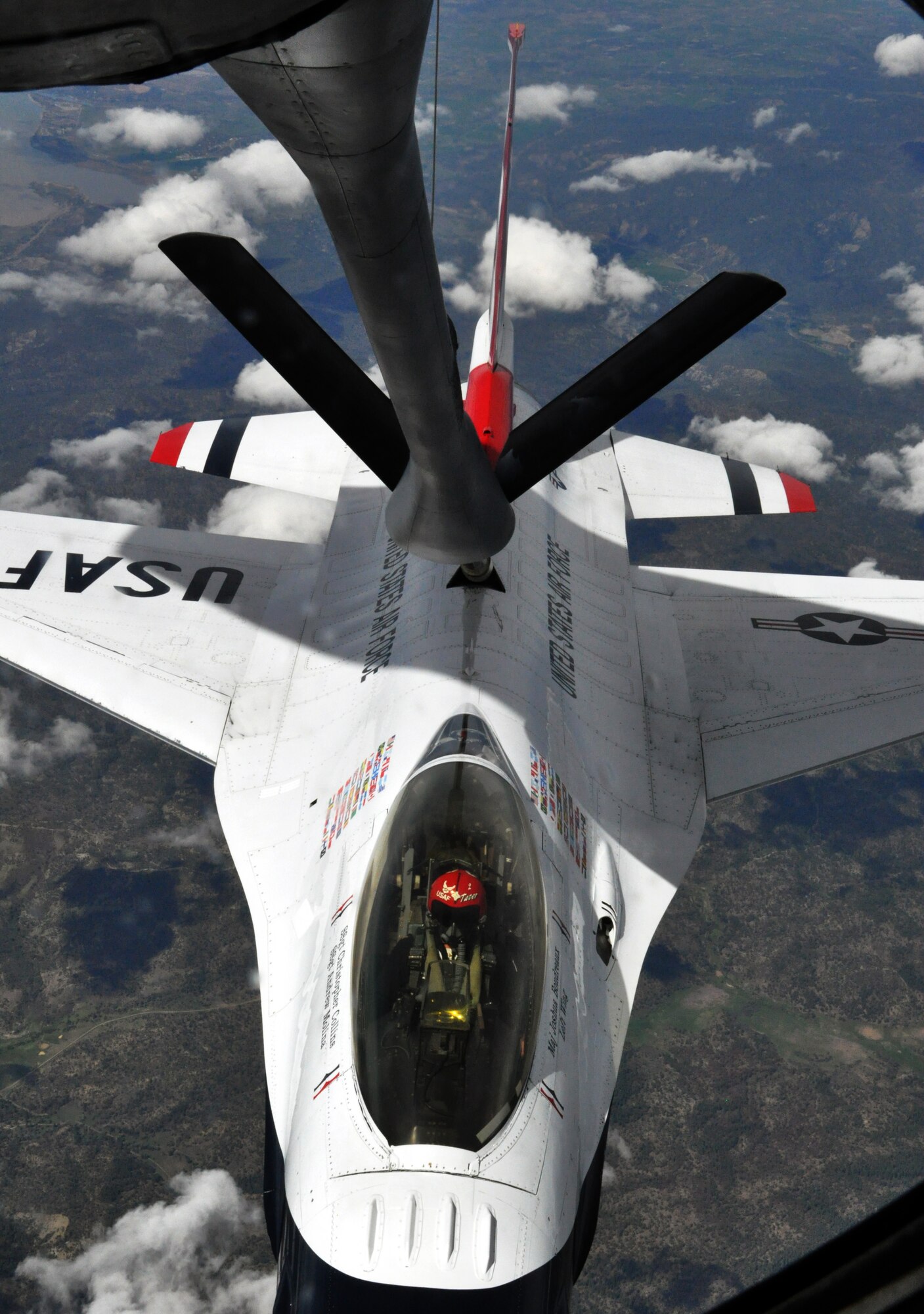 Maj. Josh Boudreaux, the left wing pilot for the U.S. Air Force Thunderbirds Air Demonstration Squadron, is refueled by a KC-135 Stratotanker from McConnell Air Force Base, Kan., May 21, 2015. The KC-135 was one of two McConnell tankers providing cross-country air refueling support for the Thunderbirds. The KC-135 aircrews, all Air Force Reservists from the 931st Air Refueling Group, provided several air refuelings for the Thunderbirds, taking them from Nellis AFB, Nev., to Long Island MacArthur Airport, Islip, N.Y., ensuring the demonstration team made it to their May 23 flight demonstration at the Jones Beach Air Show in Wantagh, N.Y. (U.S. Air Force photo by Capt. Zach Anderson)