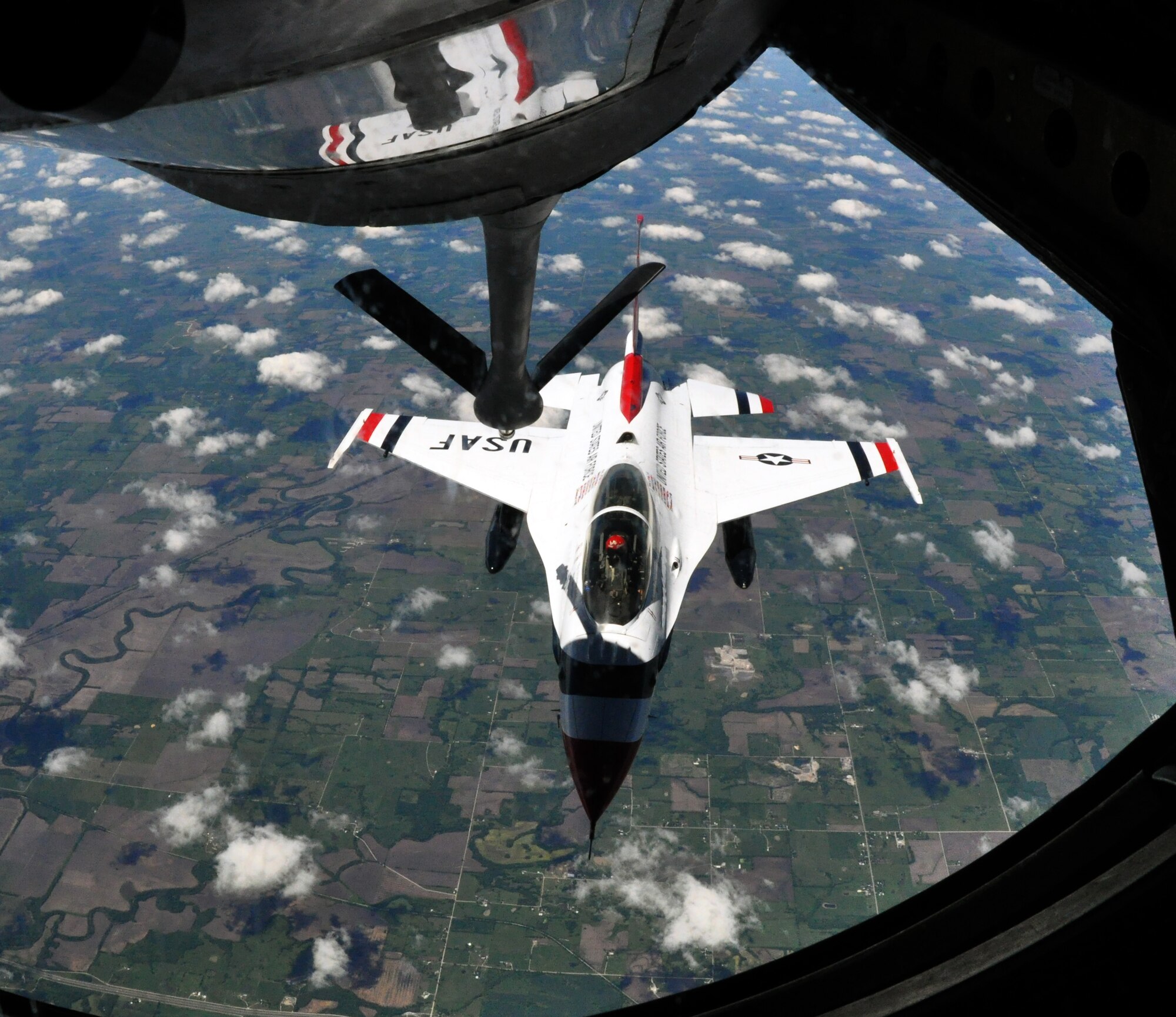 Maj. Curtis Dougherty, the slot pilot for the U.S. Air Force Thunderbirds Air Demonstration Squadron, maneuvers his F-16 Fighting Falcon aircraft to close in on the refueling boom of a KC-135 Stratotanker from McConnell Air Force Base, Kan., May 21, 2015. The KC-135 was one of two McConnell tankers providing cross-country air refueling support for the Thunderbirds. The KC-135 aircrews, all Air Force Reservists from the 931st Air Refueling Group, provided several air refuelings for the Thunderbirds, taking them from Nellis AFB, Nev., to Long Island MacArthur Airport, Islip, N.Y., ensuring the demonstration team made it to their May 23 flight demonstration at the Jones Beach Air Show in Wantagh, N.Y. (U.S. Air Force photo by Capt. Zach Anderson)