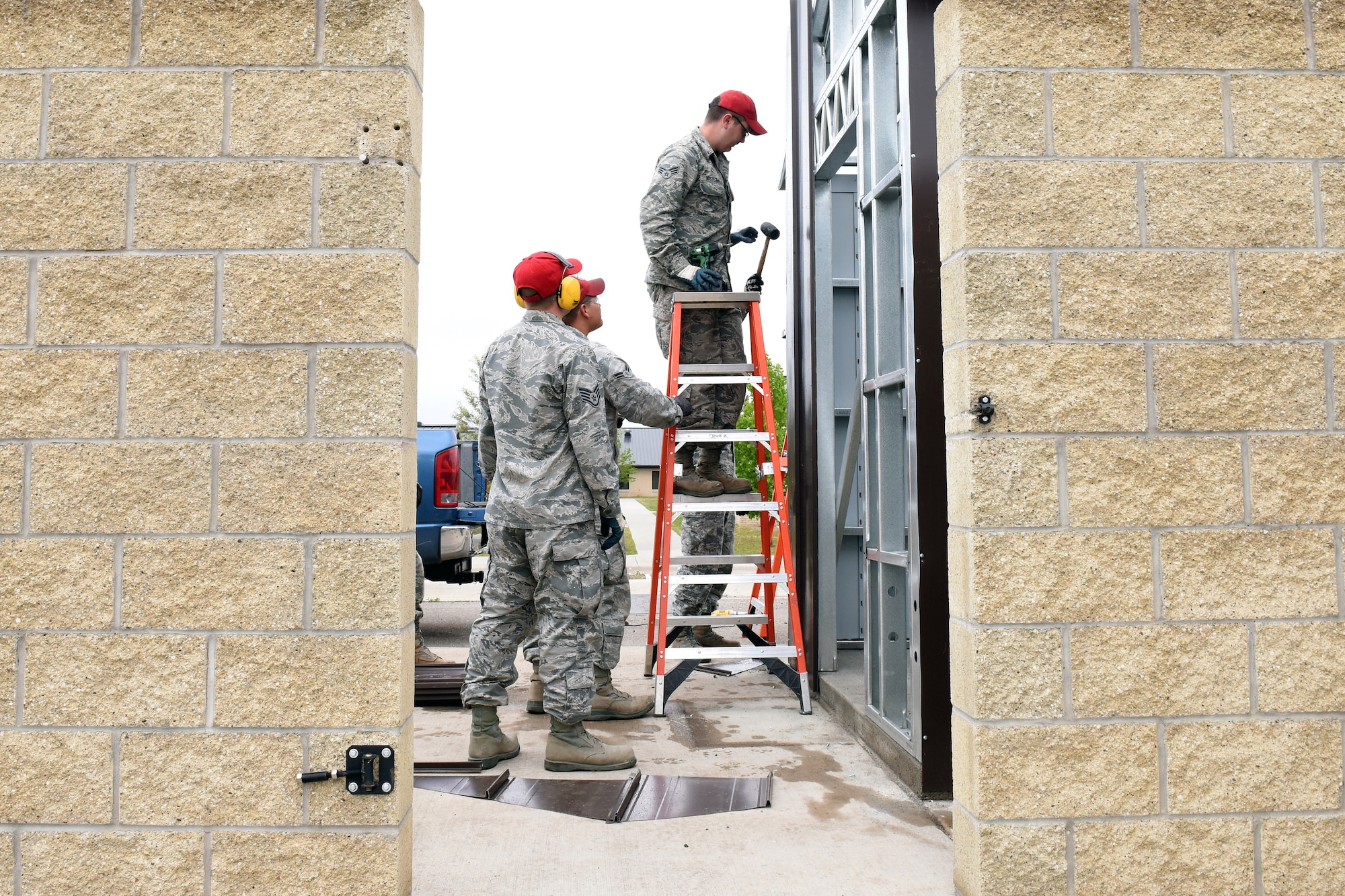 Airmen from the 819th RED HORSE Squadron structures shop build a storage shed May 20, 2015, at Malmstrom Air Force Base, Mont. The 819th RHS is a self-sufficient, mobile squadron capable of rapid response and independent operations in remote, high-threat environments worldwide. (U.S. Air Force photo/Chris Willis)