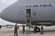 Members of the 433rd Airlift Wing greet Col. Jimmie 