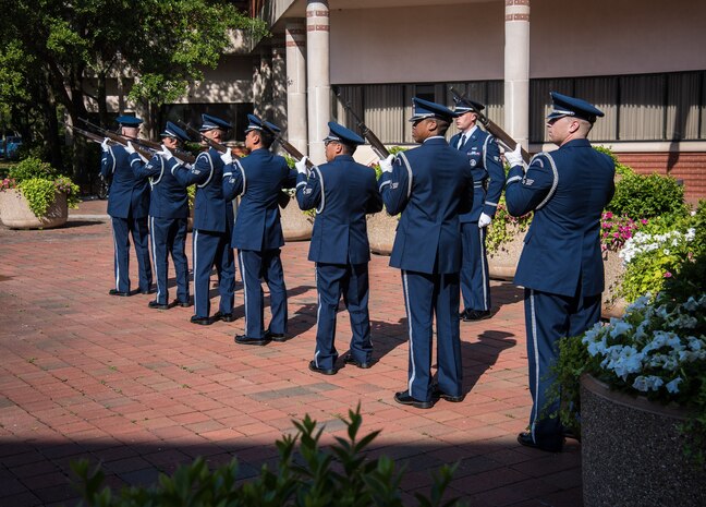 The Joint Base Charleston Honor Guard renders a 21-gun salute during SPAWAR Systems Center Atlantic's first Memorial Day observance, held May 21, 2015 on Joint Base Charleston - Naval Weapons Station, S.C. Medal of Honor recipient Marine Corps Major General (ret.) James Livingston served as the events guest speaker. (U.S. Navy Photo / Joseph Bullinger) 