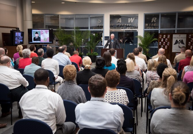 Medal of Honor recipient Marine Corps Major General (ret.) James Livingston speaks during SPAWAR Systems Center Atlantic's first Memorial Day observance, held May 21, 2015 on Joint Base Charleston - Naval Weapons Station, S.C. During the ceremony the Joint Base Charleston Honor Guard presented the colors and rendered a 21-gun salute. (U.S. Navy Photo / Joseph Bullinger) 