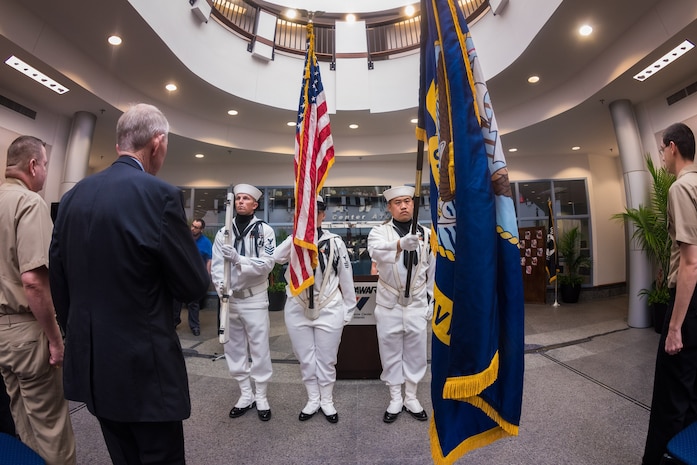 The Joint Base Charleston Honor Guard presents the colors as employees and honored guests attend SPAWAR Systems Center Atlantic's first Memorial Day observance, held May 21, 2015 on Joint Base Charleston - Naval Weapons Station. Medal of Honor recipient Maj. Gen. (ret) James Livingston was the event's guest speaker. (U.S. Navy photo / Joseph Bullinger) 