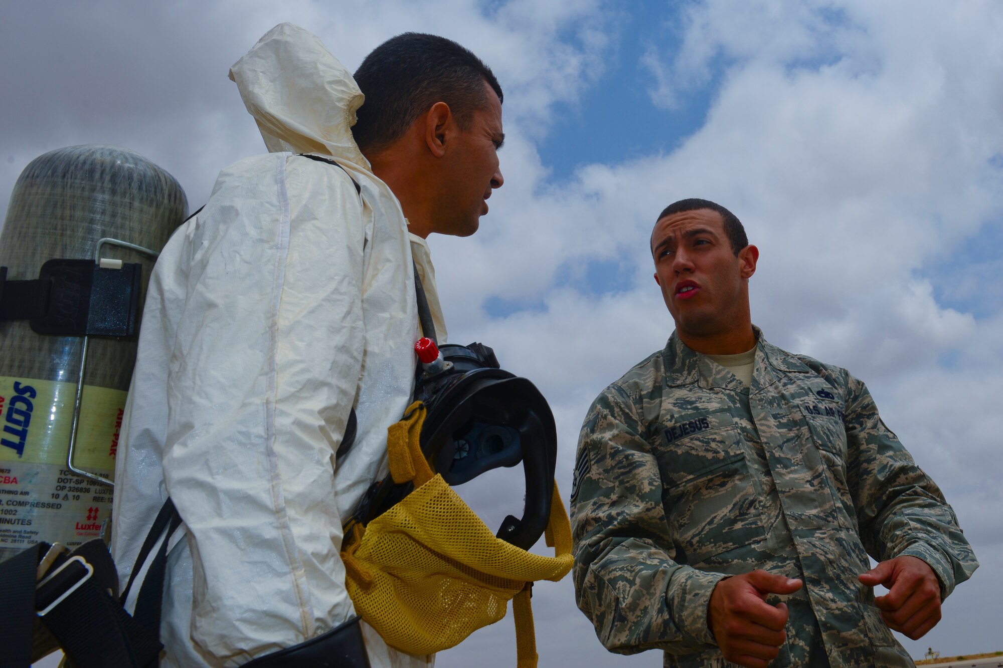 A Royal Moroccan Airman and Staff Sgt. David Dejesus, 52nd Component Maintenance Squadron aircraft fuel system repair craftsman, share expertise during a hydrazine aircraft exercise at Ben Guerir Air Base, Morocco, May 19, 2015. The exercise is part of African Lion 15. African Lion includes U.S. and Royal Moroccan Air Force F-16 pilots as well as Air National Guard and Air Force Reserve Airmen. Exercise African Lion is a U.S. Marine Corps led event with participation from the U.S. Army, German Armed Forces, British Armed Forces, Netherlands, Belgium, Senegal and Tunisia. (U.S. Air Force photo by Staff Sgt. Eboni Reams)