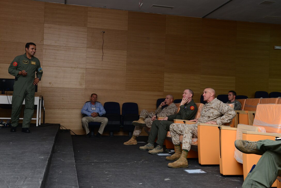 A Royal Moroccan Air Force pilot brief Maj. Gen. Richard Simcock, Exercise African Lion 15 Joint Task Force commander, and staff during a tour at Ben Guerir Air Base, Morocco, May 19, 2015. Simcock visited Ben Guerir to assess the air component of Exercise African Lion in addition to five other sites throughout Africa. African Lion is the largest Department of Defense exercise on the continent, with a vision to maximize interoperability with partner nation militaries. (U.S. Air Force photo by Staff Sgt. Eboni Reams)