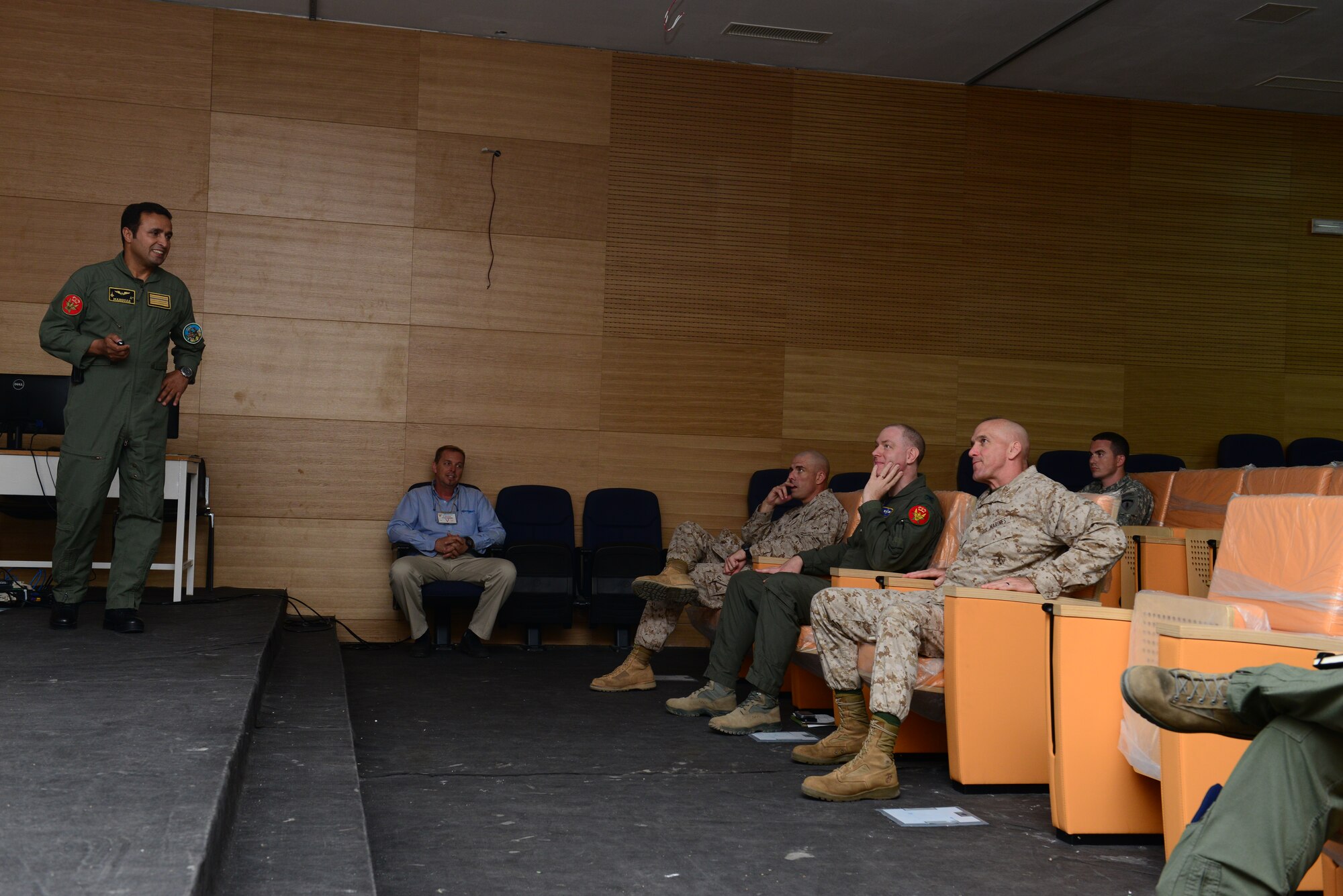 A Royal Moroccan Air Force pilot brief Maj. Gen. Richard Simcock, Exercise African Lion 15 Joint Task Force commander, and staff during a tour at Ben Guerir Air Base, Morocco, May 19, 2015. Simcock visited Ben Guerir to assess the air component of Exercise African Lion in addition to five other sites throughout Africa. African Lion is the largest Department of Defense exercise on the continent, with a vision to maximize interoperability with partner nation militaries. (U.S. Air Force photo by Staff Sgt. Eboni Reams)