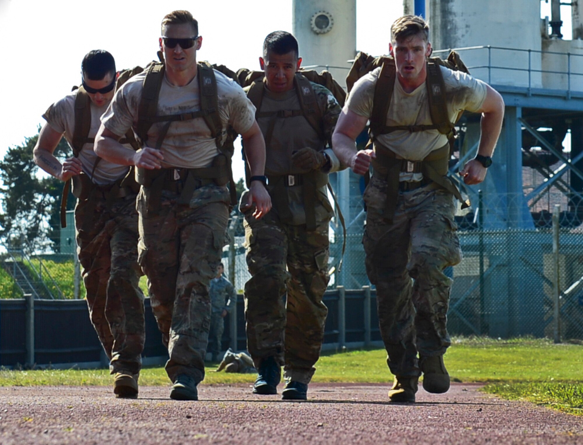 Airmen from the 48th Security Forces Squadron participate in a ruck march during the Defender’s Challenge on Royal Air Force Mildenhall, England, May 21, 2015, in honor of National Police Week. NPW is an observance held to honor law enforcement officials for their sacrifices and hard work. (U.S. Air Force photo by Airman 1st Class Dawn M. Weber/Released)
