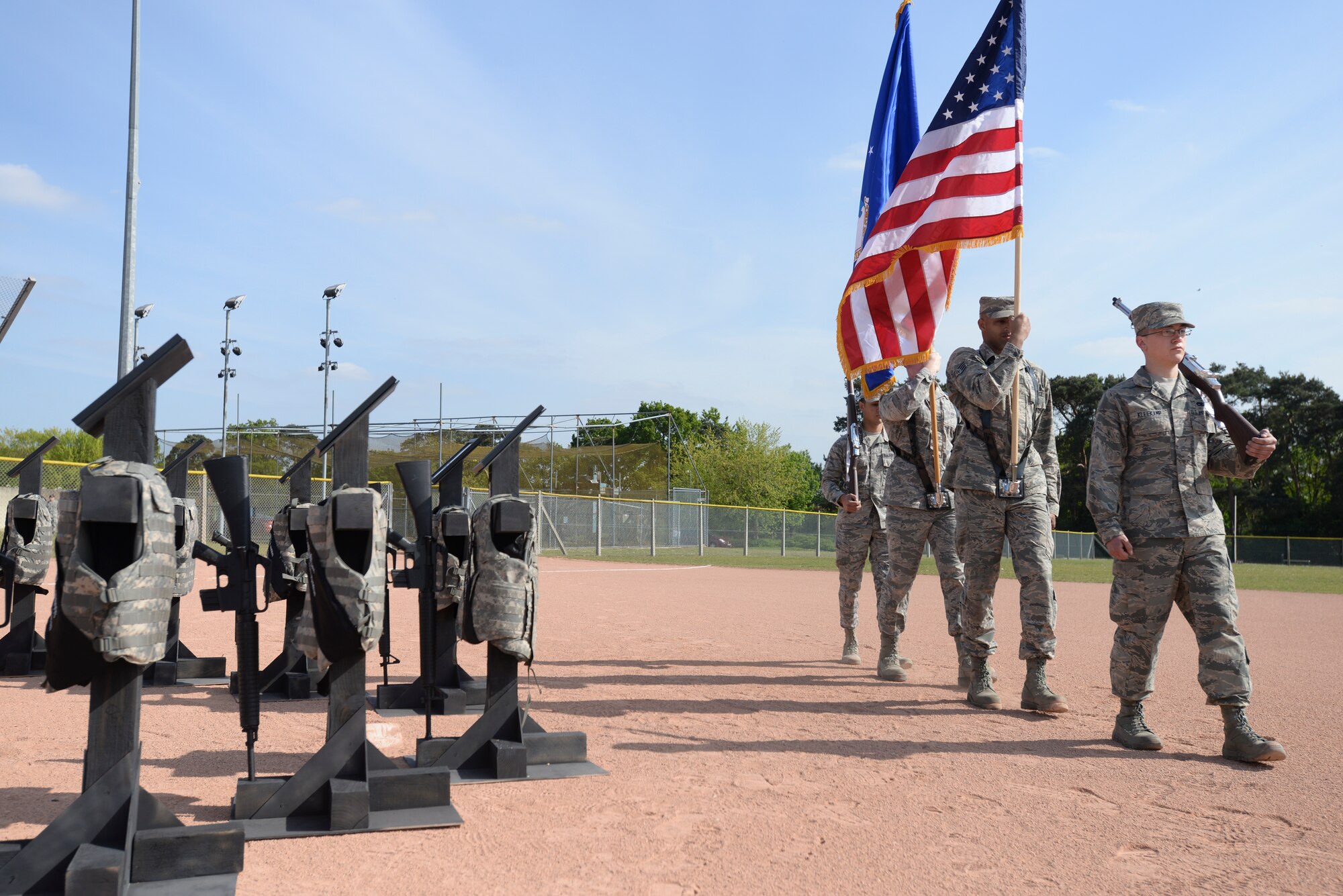 The 48th Fighter Wing Honor Guard participates in an opening memorial ceremony honoring fallen heroes May 15, 2015, at the softball field at Royal Air Force Lakenheath, England. NPW is an observance held to honor law-enforcement officials for their sacrifices. (U.S. Air Force photo by Tech. Sgt. Eric Burks/Released)