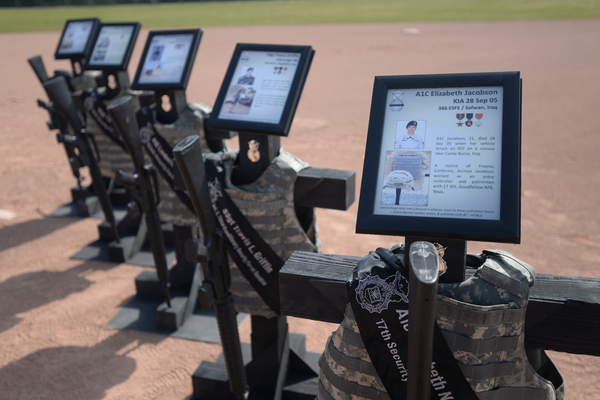 Memorials honoring fallen security forces Airmen throughout the Air Force are displayed during the opening ceremony for National Police Week, May 15, 2015 at Royal Air Force Lakenheath, England. The memorials were built by 48th Security Forces Tech. Sgts. Shannon Fulmer, NCO in charge of mobility, Nic Gonzales, NCOIC of Standardization and Evaluation section and Staff Sgt. Matthew Burgess, Standardization and Evaluations evaluator. (U.S. Air Force photo by Tech. Sgt. Eric Burks/Released)
