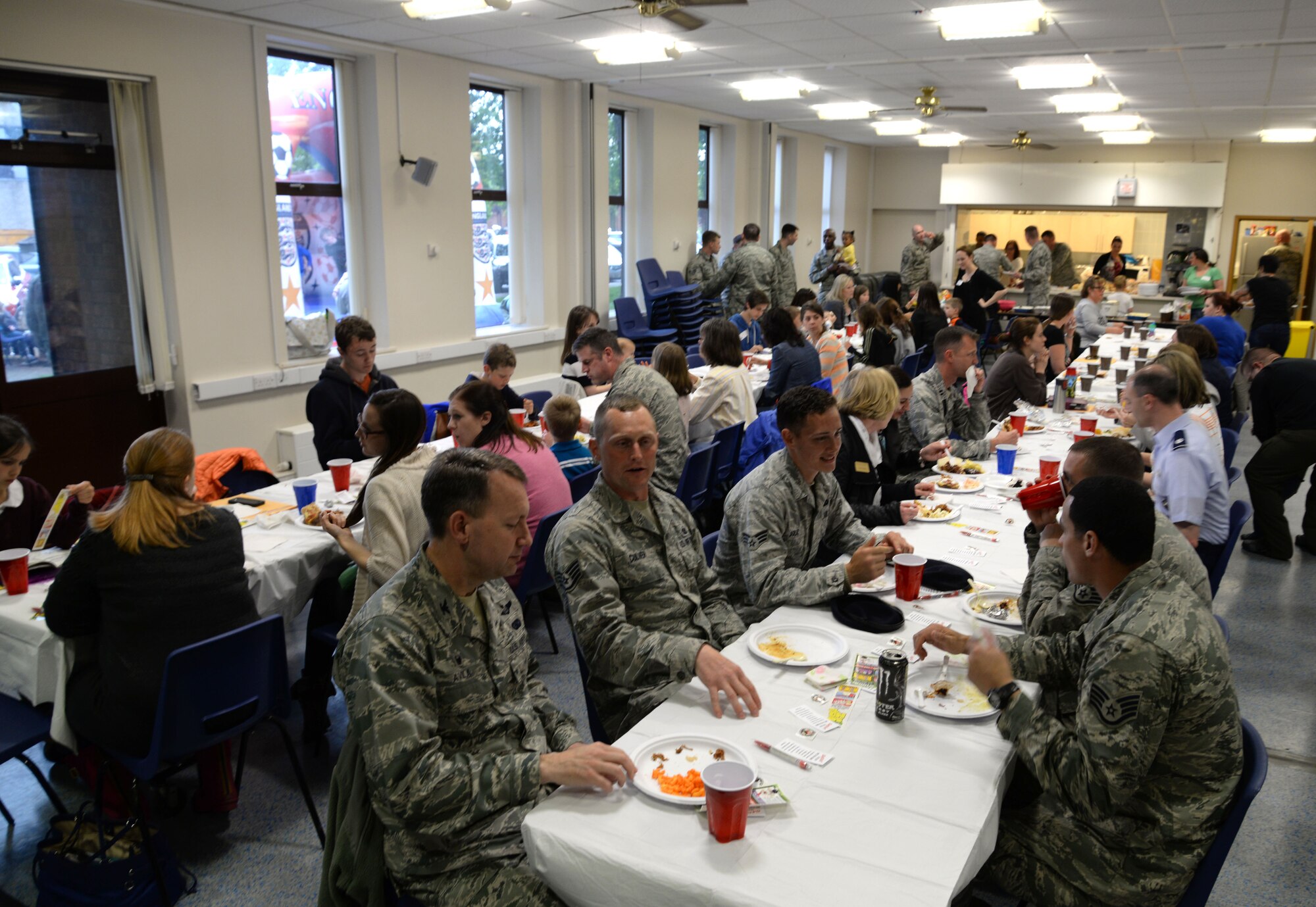 Team Mildenhall families of deployed Airmen gather for dinner a monthly Hearts Apart, May 20, 2015, on RAF Mildenhall, England. The 100th Security Forces Squadron hosted the monthly event, which helps bring Team Mildenhall families of deployed Airmen closer during times of separation. (U.S. Air Force photo by Senior Airman Christine Halan/Released)