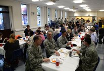 Team Mildenhall families of deployed Airmen gather for dinner a monthly Hearts Apart, May 20, 2015, on RAF Mildenhall, England. The 100th Security Forces Squadron hosted the monthly event, which helps bring Team Mildenhall families of deployed Airmen closer during times of separation. (U.S. Air Force photo by Senior Airman Christine Halan/Released)