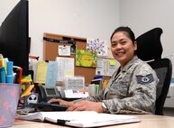 U.S. Air Force Tech. Sgt. Ma Annabelle Maligaya, 100th Maintenance Operations Flight Wing analyst from Kissimmee, Fla., poses for a photograph at her desk May 21, 2015, on RAF Mildenhall, England. Maligaya was awarded the Square D Spotlight for displaying the core value of Excellence in All We Do. (U.S. Air Force photo by Senior Airman Christine Halan/Released)