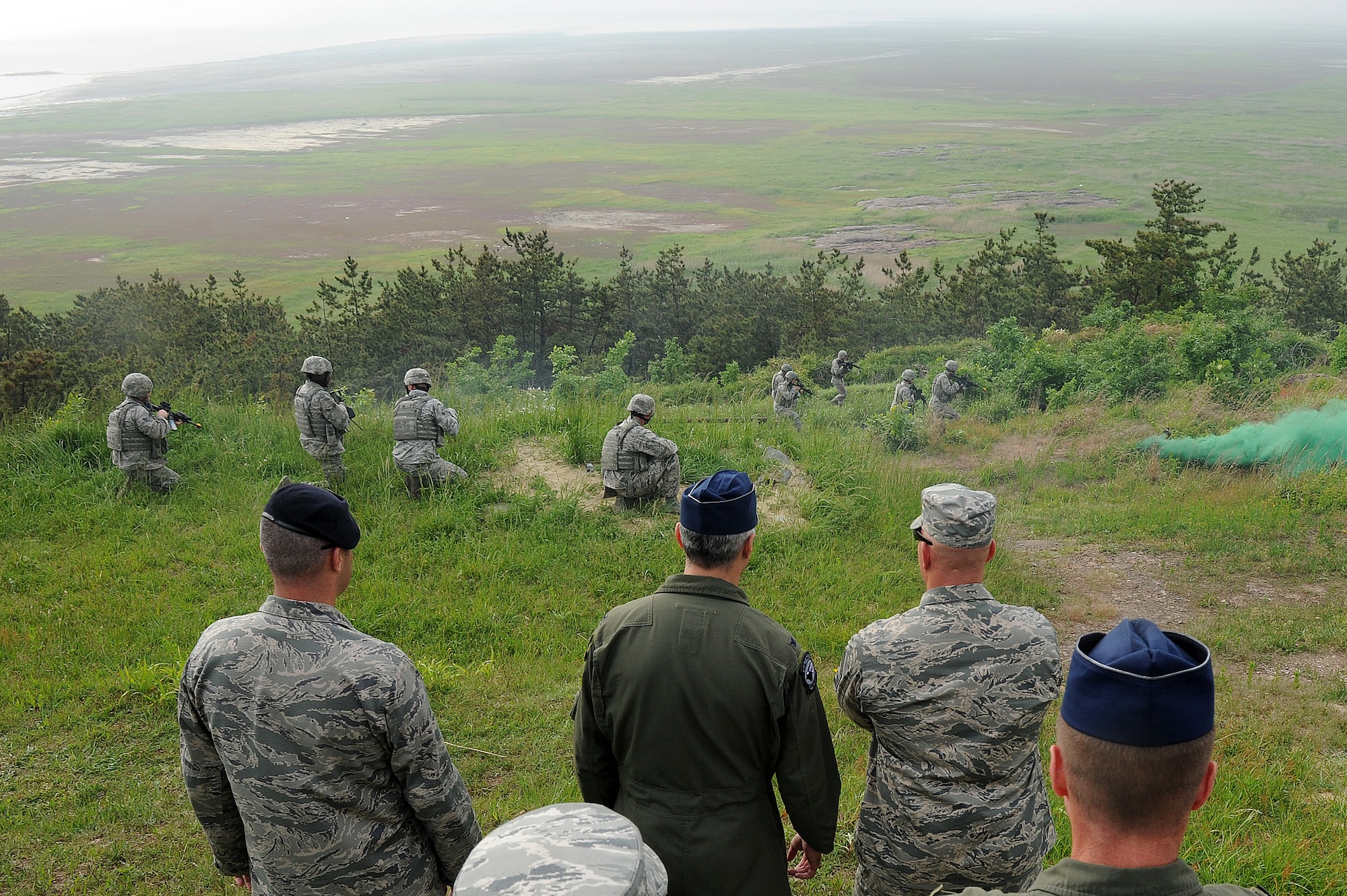 Col. Jeremy “Wolf” Sloane, 8th Fighter Wing commander, and Chief Master Sgt. Daniel “Wolf Chief” Simpson, 8th FW command chief, receive a deterrence tactics demonstration from the 8th Security Forces Squadron at Kunsan Air Base, Republic of Korea, May 19, 2015. During Sloane’s first week with the Wolf Pack, he received a mission brief, assumed command as Wolf 55, and conducted five commander’s calls to meet the men and women of Kunsan. (U.S. Air Force photo by Senior Airman Divine Cox/Released)