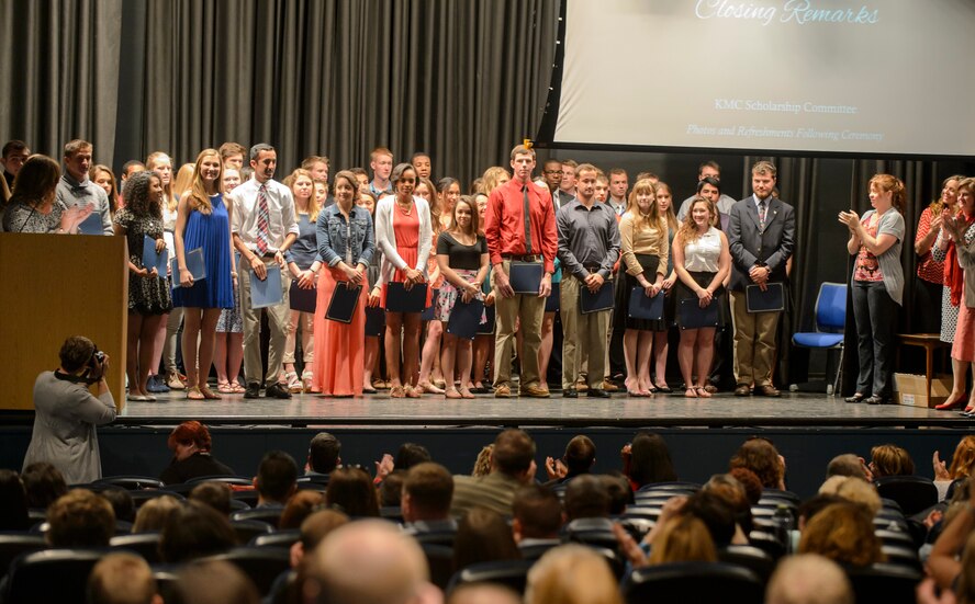 Graduating high school students stand for photos after receiving their scholarships for higher education May 17, 2015, at Ramstein Air Base, Germany. More than 85 spouses and students received a combined total of more than $120,000 in scholarships during the event. (U.S. Air Force photo/Staff Sgt. Armando A. Schwier-Morales) 