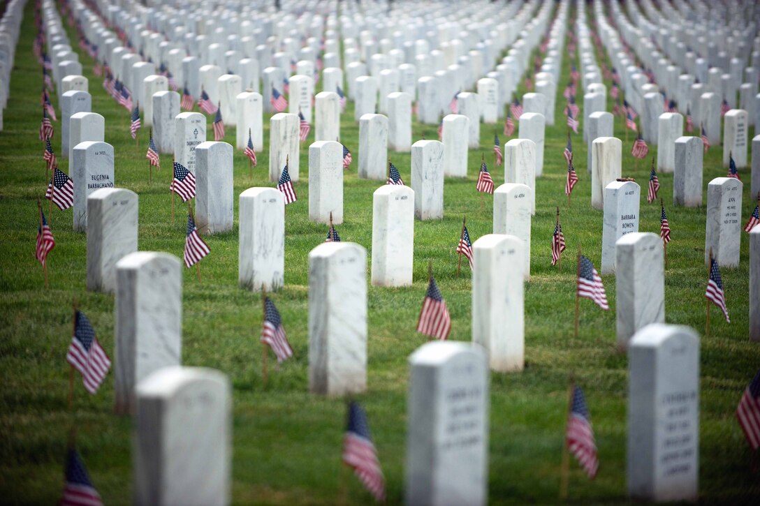 A total of 228,000 American flags stand at every headstone during ...