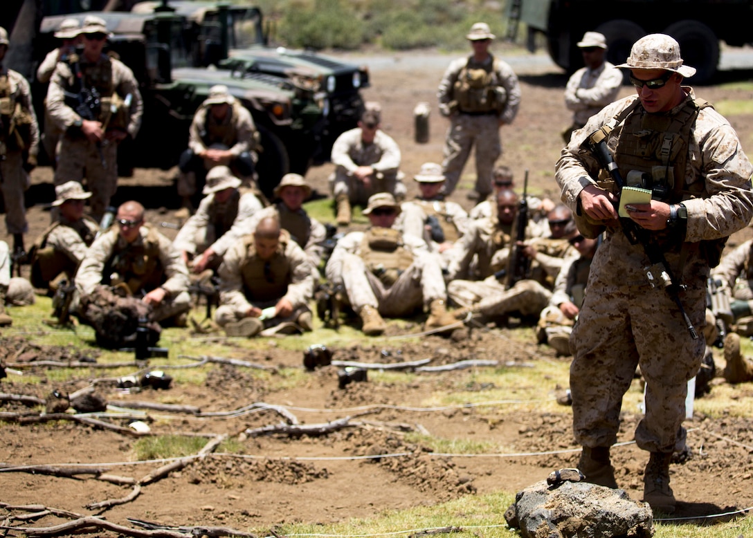 U.S. Marine Corps 2nd Lieutenant Matthew H. Brewer briefs the Marines on their objectives during a company-sized assault on Range 10 during Operation Lava Viper at Pohakuloa Training Area, Hawaii, May 21, 2015. Brewer is a platoon commander assigned to the 1st Battalion, 3rd Marines, Alpha Company, 3rd Platoon.