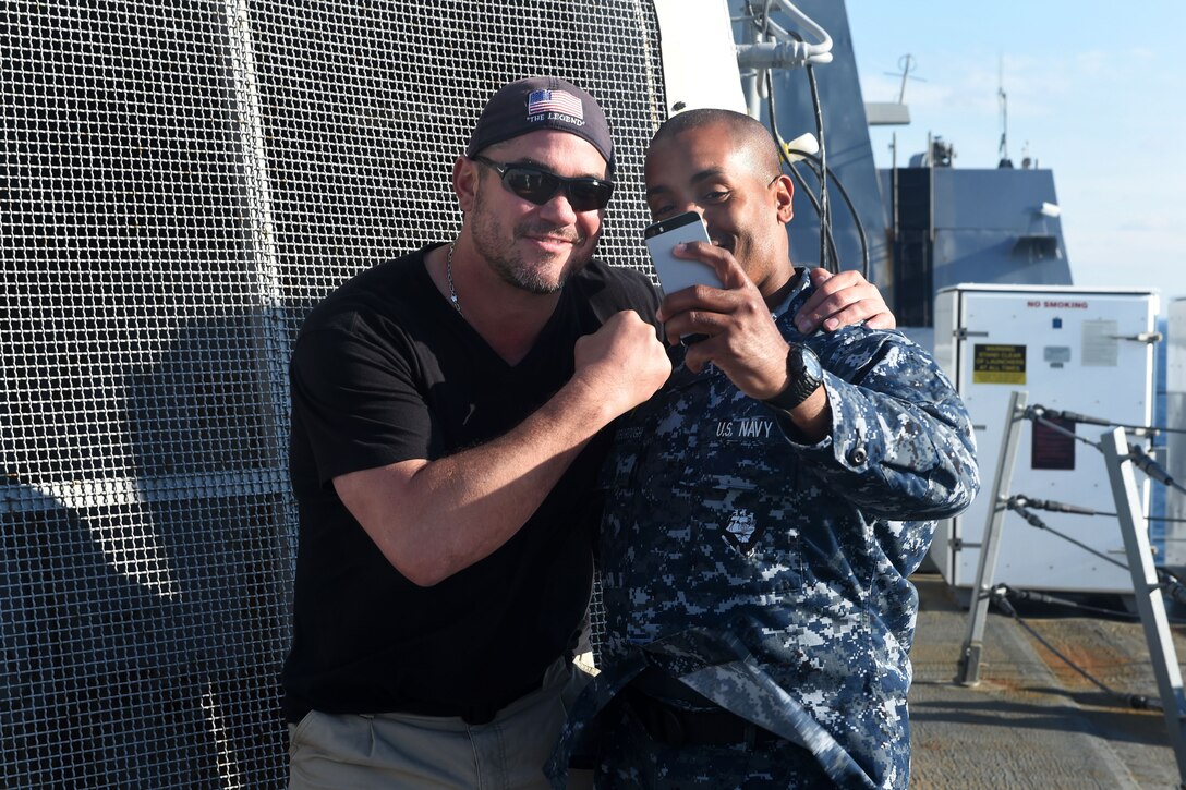 Navy Master-at-Arms Seaman Nicholas Scarborough, right, takes a selfie with actor Dean Cain aboard the amphibious transport dock ship USS San Antonio in New York City during Fleet Week New York, May 20, 2015.