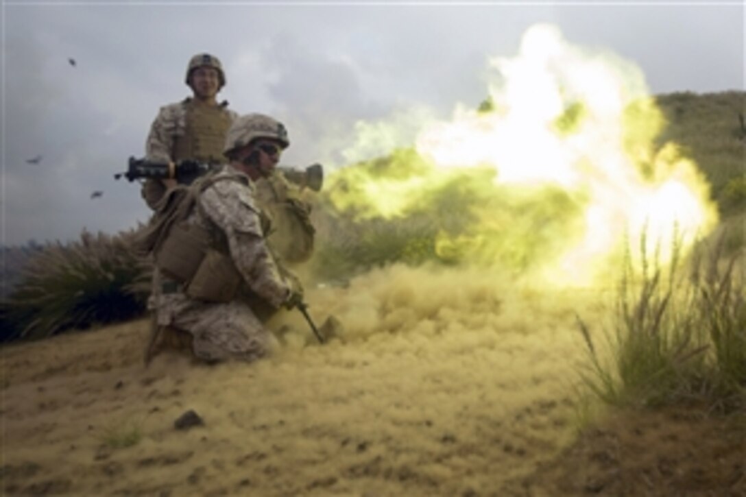 U.S. Marine Corps Pfc. Jonathan D. Eatman, front, fires an AT4 as Sgt. Calum J. Boyes stands by during a simulated assault as part of Operation Lava Viper on Range 10 on Pohakuloa Training Area, Hawaii, May 21, 2015. The Marines are assigned to Alpha Company, 1st Battalion, 3rd Marine Regiment.