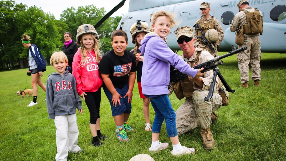 Kids of all ages joined the Marines of 1st Battalion, 6th Marine Regiment, during an aerial landing event as part of Fleet Week New York, May 21, 2015. Marines with Special-Purpose Marine Air Ground Task Force-New York showcase the capabilities of the Marine Corps both physically, mentally and technologically during Fleet Week New York. Fleet Week is an annual event that provides New York and surrounding area a chance to see the sea services capabilities.