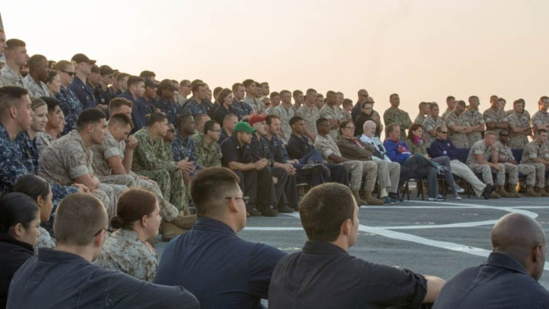 Marines and sailors look on as the United Service Organizations performers sing at a free concert aboard the USS San Antonio en route from Norfolk, Va., to Fleet Week New York May 19, 2015. Approximately 1,800 Marines, sailors and Coast Guardsmen participate in this year’s annual Fleet Week New York, May 20-26, 2015. Fleet Week provides the people of New York and surrounding area a chance to see the capabilities of the sea services, as well getting the opportunity to meet the Marines, sailors and Coast Guardsmen. 