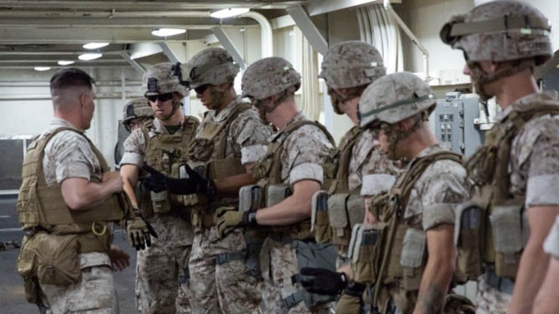 Marines with Charlie Co, 1st Battalion, 6th Marine Regiment get ready to perform insertion and extraction drills aboard the USS San Antonio, May 19, 2015, as part of preparation for training in the Baltic region after Fleet Week New York. Approximately 1,800 Marines, sailors and Coast Guardsmen participate in this year’s annual Fleet Week New York, May 20-26, 2015. Fleet Week provides the people of New York and surrounding area a chance to see the capabilities of the sea services, as well getting the opportunity to meet the Marines, sailors and Coast Guardsmen. 