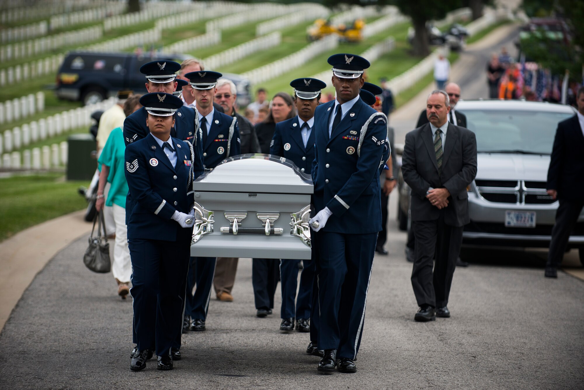 Members of Scott Air Force Base Honor Guard transfer Tech. Sgt. Louis Clever to his final resting place, May 22, 2015, at Jefferson Barracks National Cemetery, St. Louis Missouri. Clever passed away in 1969, when his plane went down; his son Paul travelled to Laos to discover his remains. (U.S. Air Force photo by Staff Sgt. Clayton Lenhardt/Released)