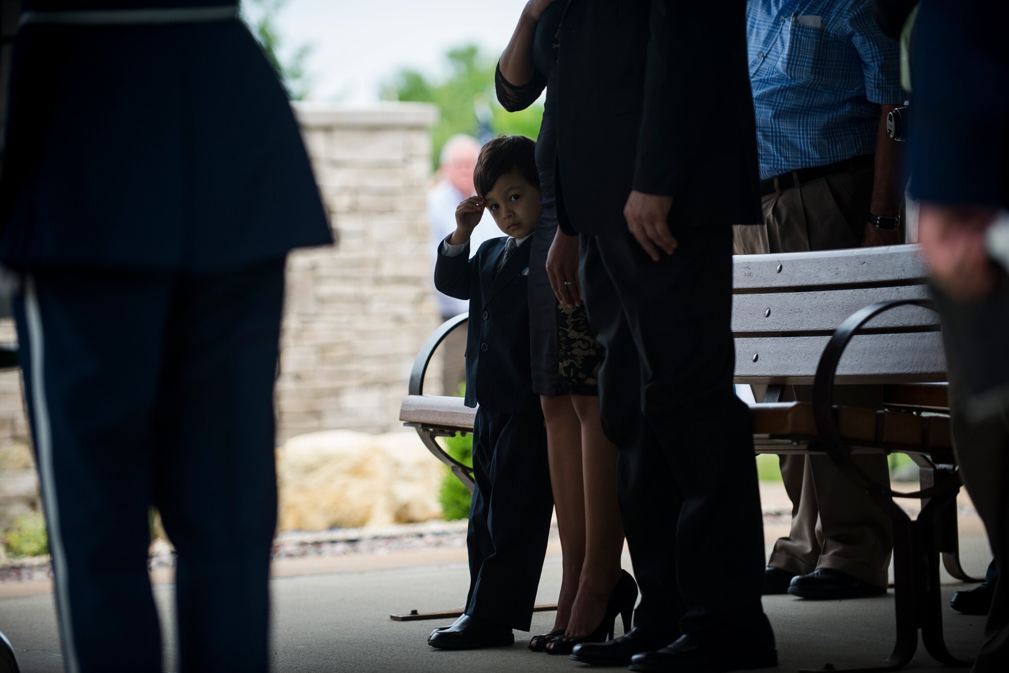 Marcus Clever renders a salute as Taps is played during the funeral of his grandfather, Tech. Sgt. Louis Clever, May 22, 2015, at Jefferson Barracks National Cemetery, St. Louis Missouri. Clever passed away in 1969, when his plane went down; his son Paul travelled to Laos to discover his remains. (U.S. Air Force photo by Staff Sgt. Clayton Lenhardt/Released)