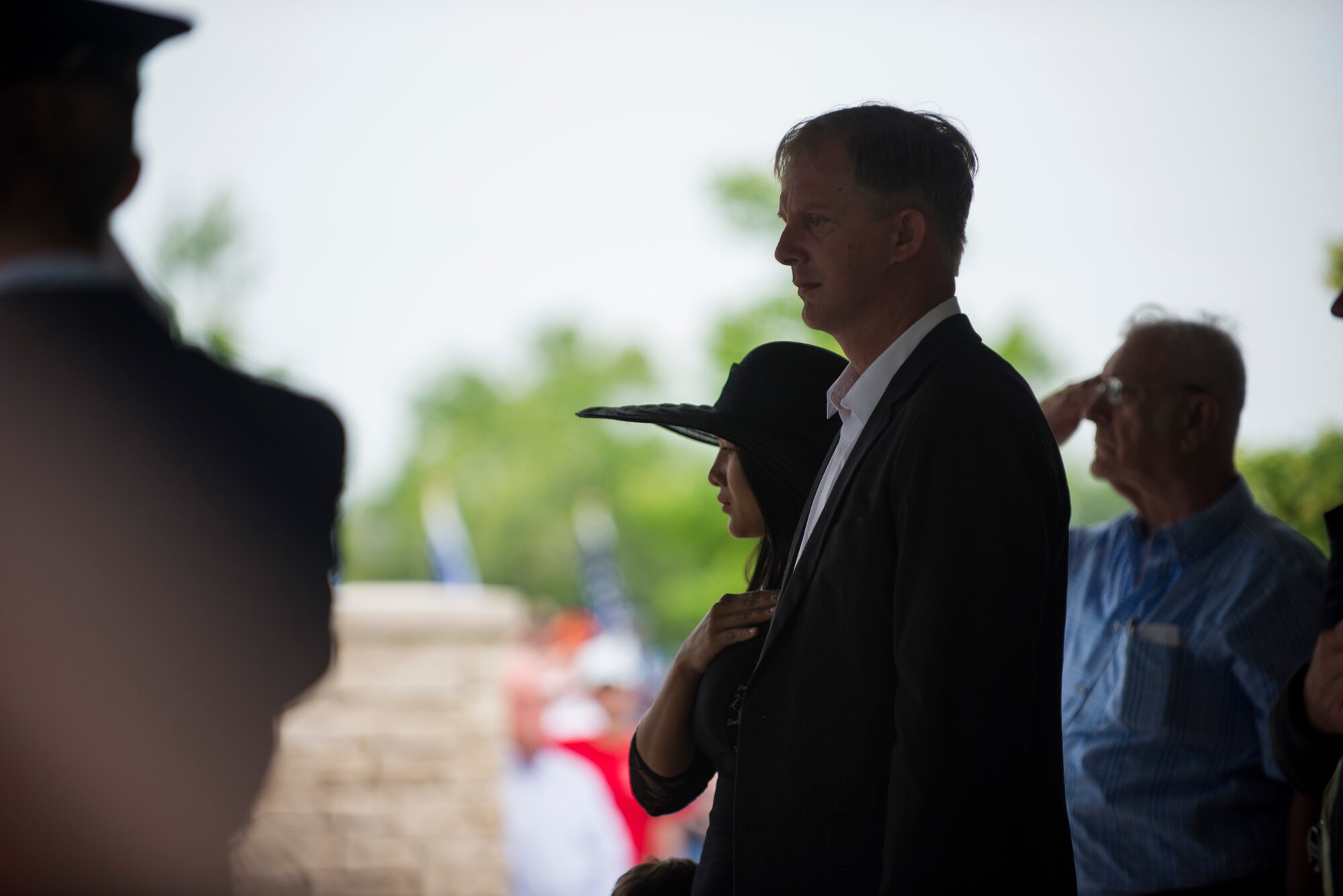 Paul Clever reflects as Taps is played during the funeral of his father, Tech. Sgt. Louis Clever, May 22, 2015, at Jefferson Barracks National Cemetery, St. Louis, Missouri. Paul travelled to Laos to find the remains of his father and hold a proper funeral for him. (U.S. Air Force photo by Staff Sgt. Clayton Lenhardt/Released)