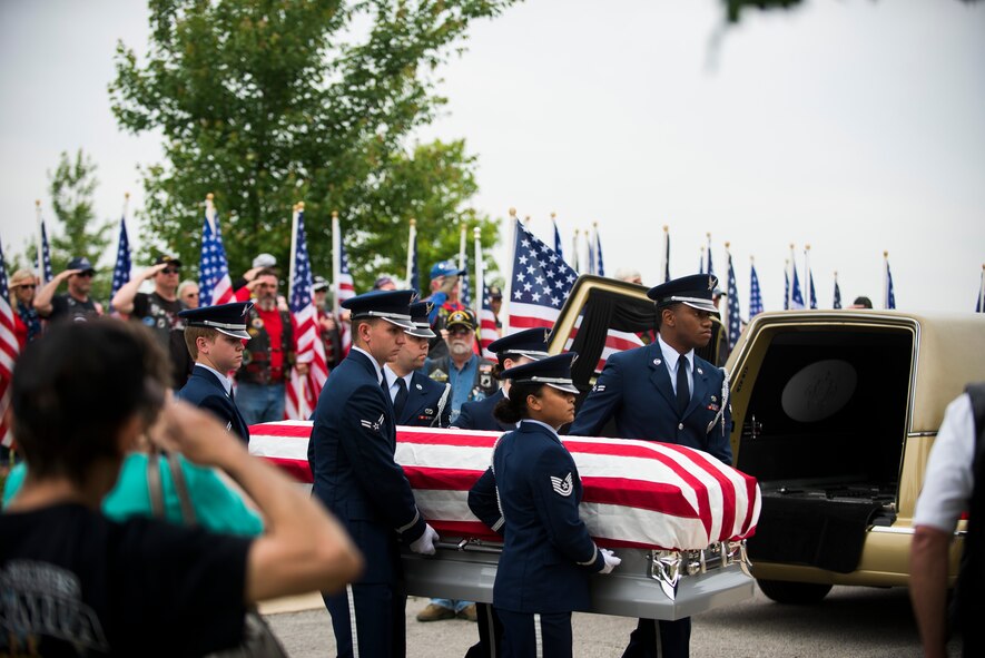Members of Scott Air Force Base Honor Guard transfer Tech. Sgt. Louis Clever during his funeral May 22, 2015, at Jefferson Barracks National Cemetery, St. Louis, Missouri. Clever passed away in 1969, when his plane went down; his son Paul travelled to Laos to discover his remains. (U.S. Air Force photo by Staff Sgt. Clayton Lenhardt/Released)