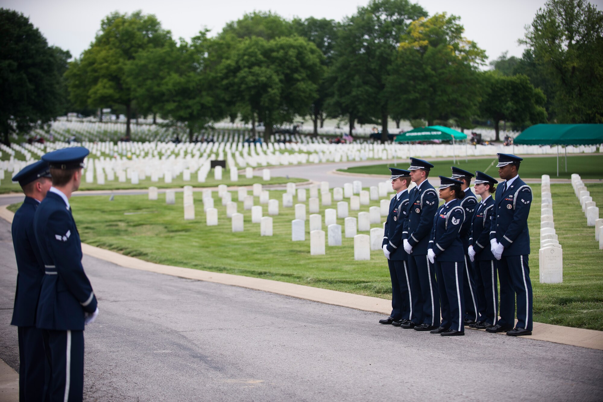 Members of Scott Air Force Base Honor Guard await the funeral procession for Tech. Sgt. Louis Clever May 22, 2015, at Jefferson Barracks National Cemetery, St. Louis, Missouri. Clever passed away in 1969, when his plane went down; his son Paul travelled to Laos to discover his remains. (U.S. Air Force photo by Staff Sgt. Clayton Lenhardt/Released)