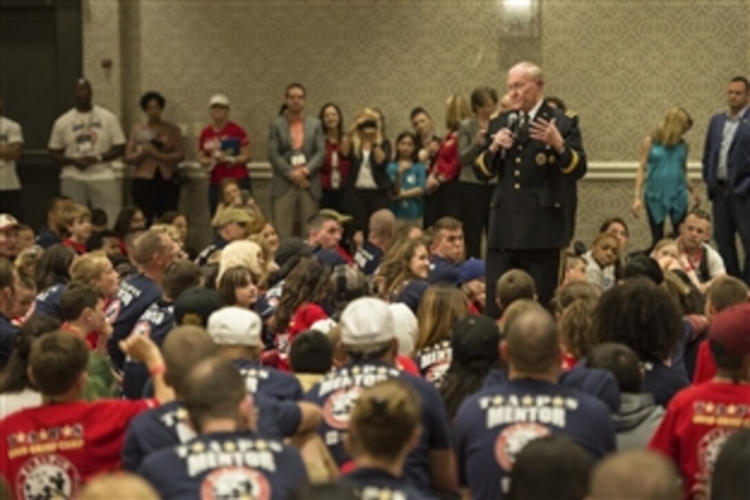 Army Gen. Martin E. Dempsey, chairman of the Joint Chiefs of Staff, talks with children at the 21st annual seminar and Good Grief Camp for Young Survivors through the Tragedy Assistance Program for Survivors in Arlington, Va., May 22, 2015. The program, known as TAPS, offers support for military families who have lost a family member serving in the military.