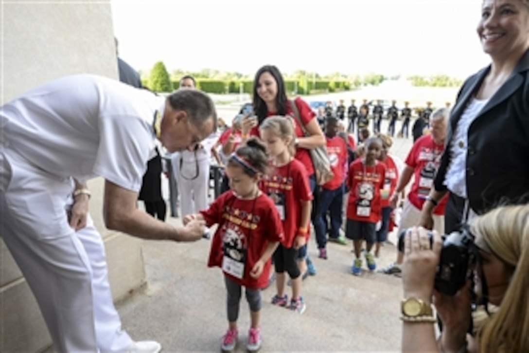 Navy Adm. James A. Winnefeld Jr., vice chairman of the Joint Chiefs of Staff, greets members of the Tragedy Assistance Program for Survivors at the Pentagon, May 22, 2015. The Pentagon hosted the families for a night of fun and remembrance to mark Memorial Day. The program, known as TAPS, offers support for military families who have lost a family member serving in the military.