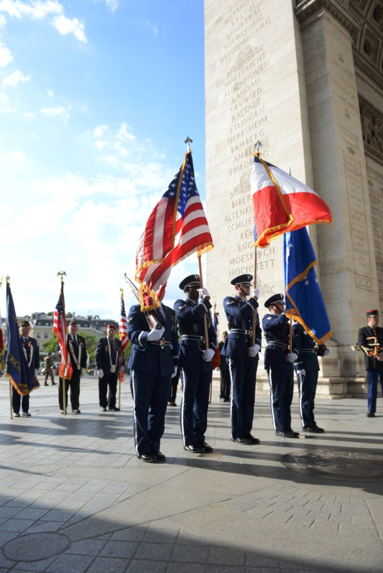 The honor guard from the 86th Airlift Wing, Ramstein Air Base, Germany, presents the colors during a Memorial Day ceremony at the Arc de Triomphe in Paris, France, May 24, 2014, to pay respect to the Tomb of the Unknown Soldier on Memorial Day weekend.  The ceremony paid tribute to fallen comrades and was attended by approximately 100 U.S. and French service members, civilians and families. (U.S. Air Force photo by Maj. Sheryll Klinkel/Released)