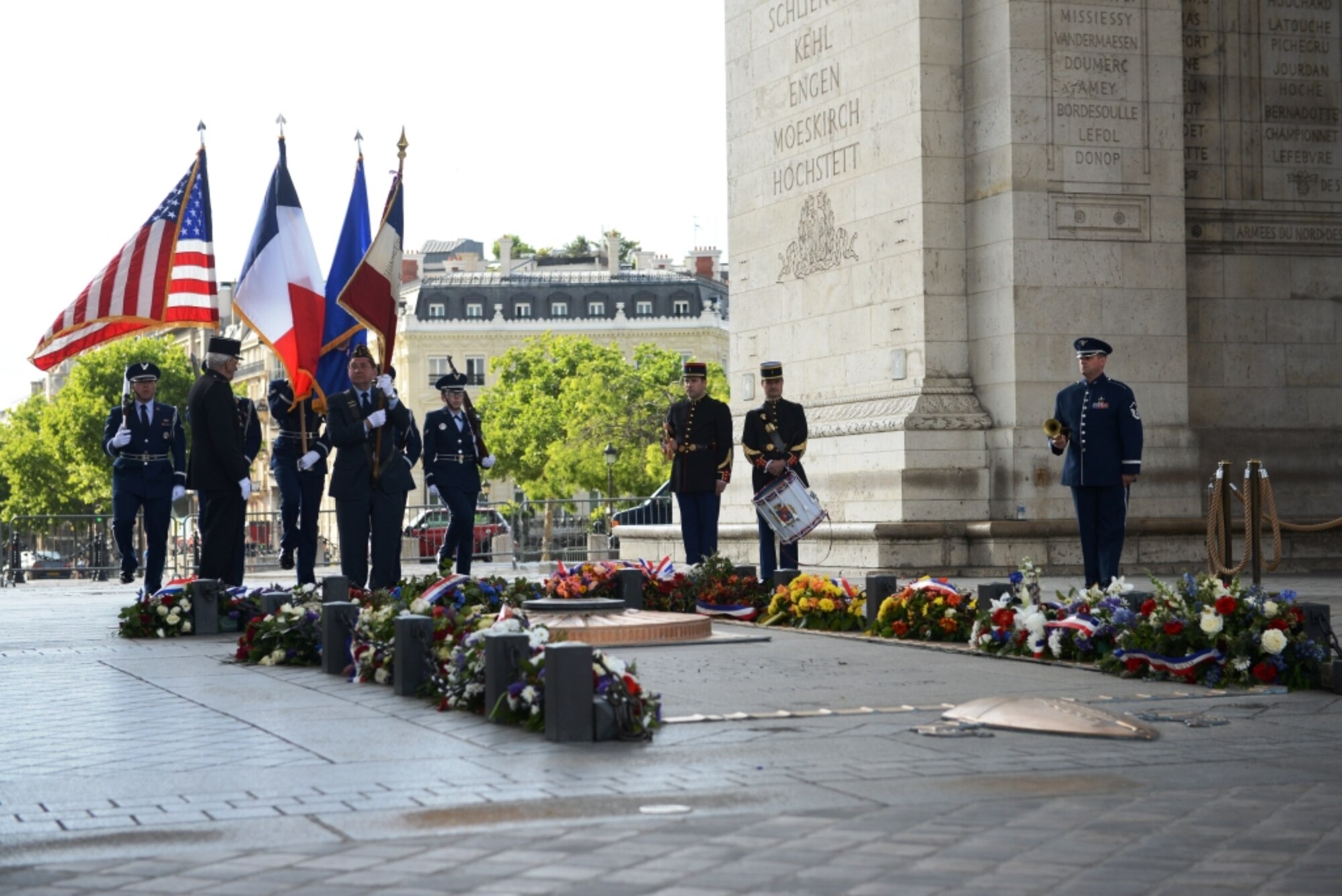 Airmen from the 86th Airlift Wing and United States Forces in Europe – Air Forces Africa, Ramstein Air Base, Germany, participate in a Memorial Day ceremony at the Arc de Triomphe in Paris, France, May 24, 2015, to pay respects to the Tomb of the Unknown Soldier on Memorial Day weekend. The Unknown French Soldier died during WWI and is buried beneath the Arc de Triomphe. While his identity is still unknown, he is daily remembered with wreaths and an eternal flame. (U.S. Air Force photo by Maj. Sheryll Klinkel/Released)