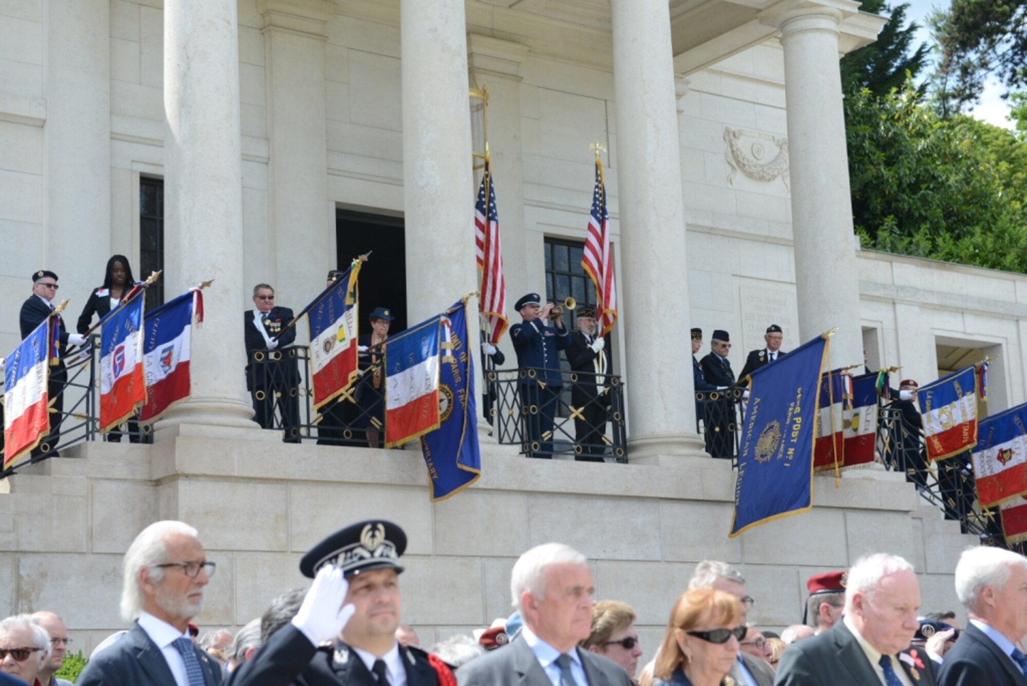 Master Sgt. Dave Dell, U.S. Air Forces in Europe Band, concludes a Memorial Day ceremony at Suresness American Ceremony, near Paris, France, with the playing of “Taps” May 24, 2015. Approximately 200 U.S. service members and civilians attended the ceremony to pay tribute to fallen comrades. (U.S. Air Force photo by Maj. Sheryll Klinkel/Released)