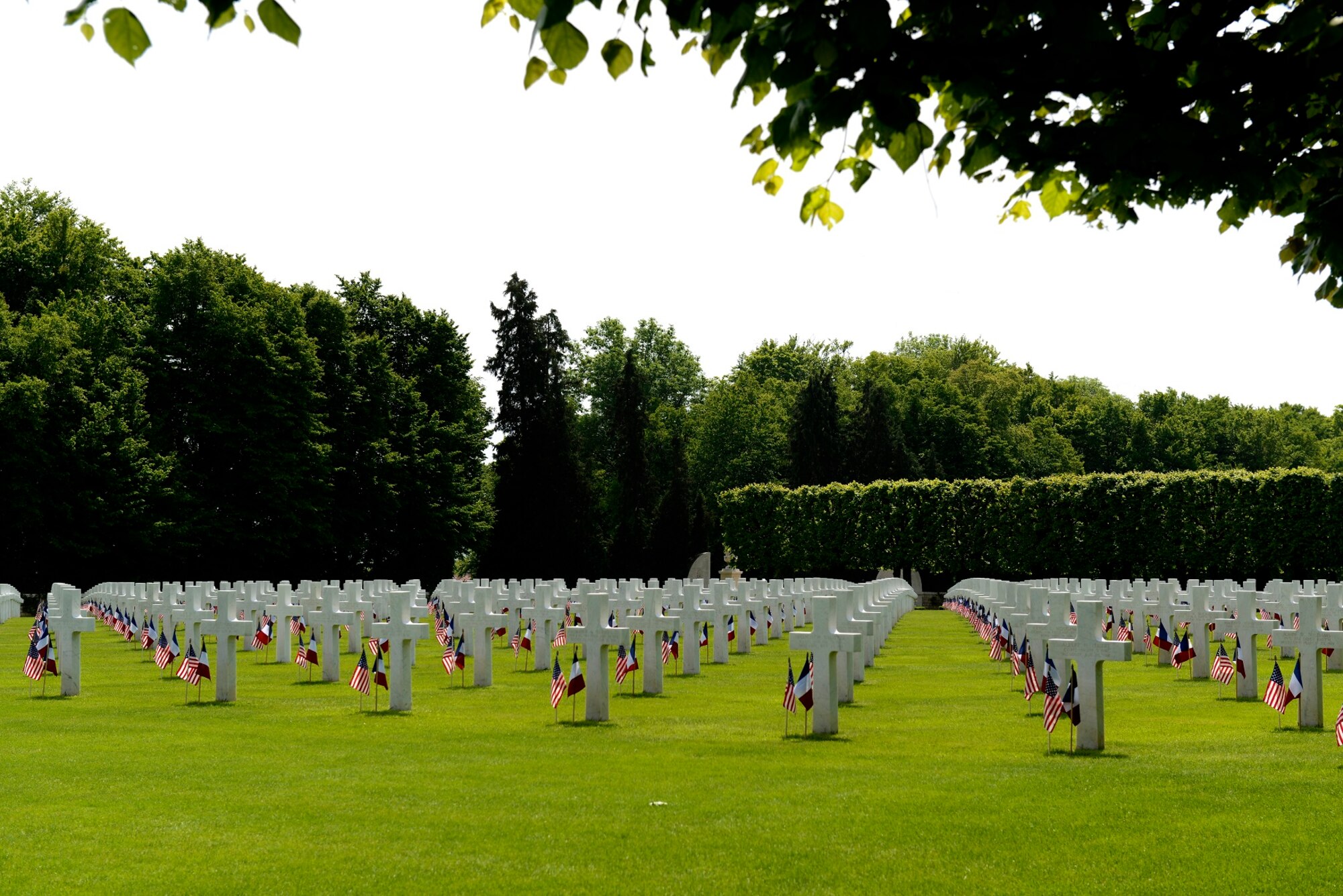U.S. and French national flags are placed among the headstones at St. Mihiel American Cemetery May 24, 2015, in Thiaucourt, France. More than 4,100 U.S. military members from World War I are buried in the cemetery where local community leaders gathered with U.S. Air Forces in Europe servicemembers to pay tribute to those who gave the ultimate sacrifice. (U.S. Air Force photo/Airman 1st Class Tryphena Mayhugh)