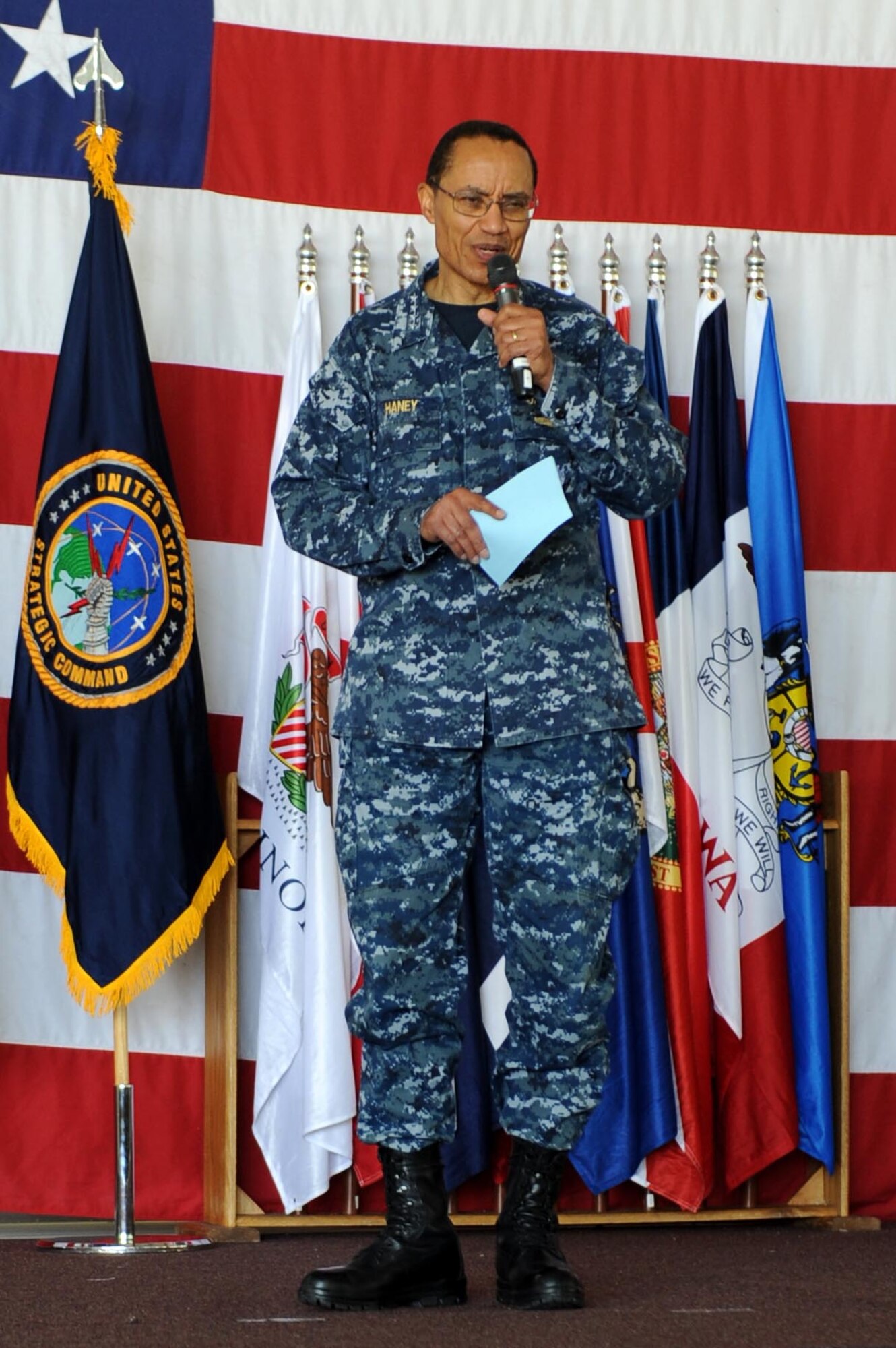 U.S. Navy Adm. Cecil D. Haney, U.S. Strategic Command commander, provides the keynote speech before presenting Omaha Trophies to the 5th Bomb Wing, strategic aircraft operations category, and 91st Missile Wing, intercontinental ballistic missile wing category, on Minot Air Force Base, N.D., May 20, 2015. Minot is home to two of the four Omaha Trophy-winning units for 2014, which joined winners in the ballistic missile submarine and global operations (space/cyberspace) unit categories. Those receiving the awards represent units throughout USSTRATCOM which are critical to fulfilling the combatant command's primary mission: to detect, deter and prevent strategic attacks against the United States and its allies. USSTRATCOM is one of nine unified commands under the Department of Defense and is responsible for strategic deterrence; space operations; cyberspace operations; joint electronic warfare; global strike; missile defense; intelligence, surveillance and reconnaissance; combating weapons of mass destruction; and analysis and targeting.  (U.S. Air Force photo/Senior Airman Kristoffer Kaubisch)