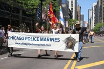 Gold Star families and members of the Chicago Police Marines approach the reviewing area during the Chicago Memorial Day Parade May 23, 2015. The annual parade is considered one of the largest in the nation and attracts thousands of visitors each year to remember those who have paid the ultimate sacrifice for American freedom.