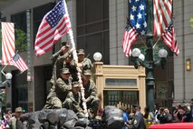 JROTC students recreate the flag raising on Mount Suribachi as part of their float during the 2015 Chicago Memorial Day Parade May 23, 2015. The annual parade is considered one of the largest in the nation and attracts thousands of visitors each year to remember those who have paid the ultimate sacrifice for American freedom.