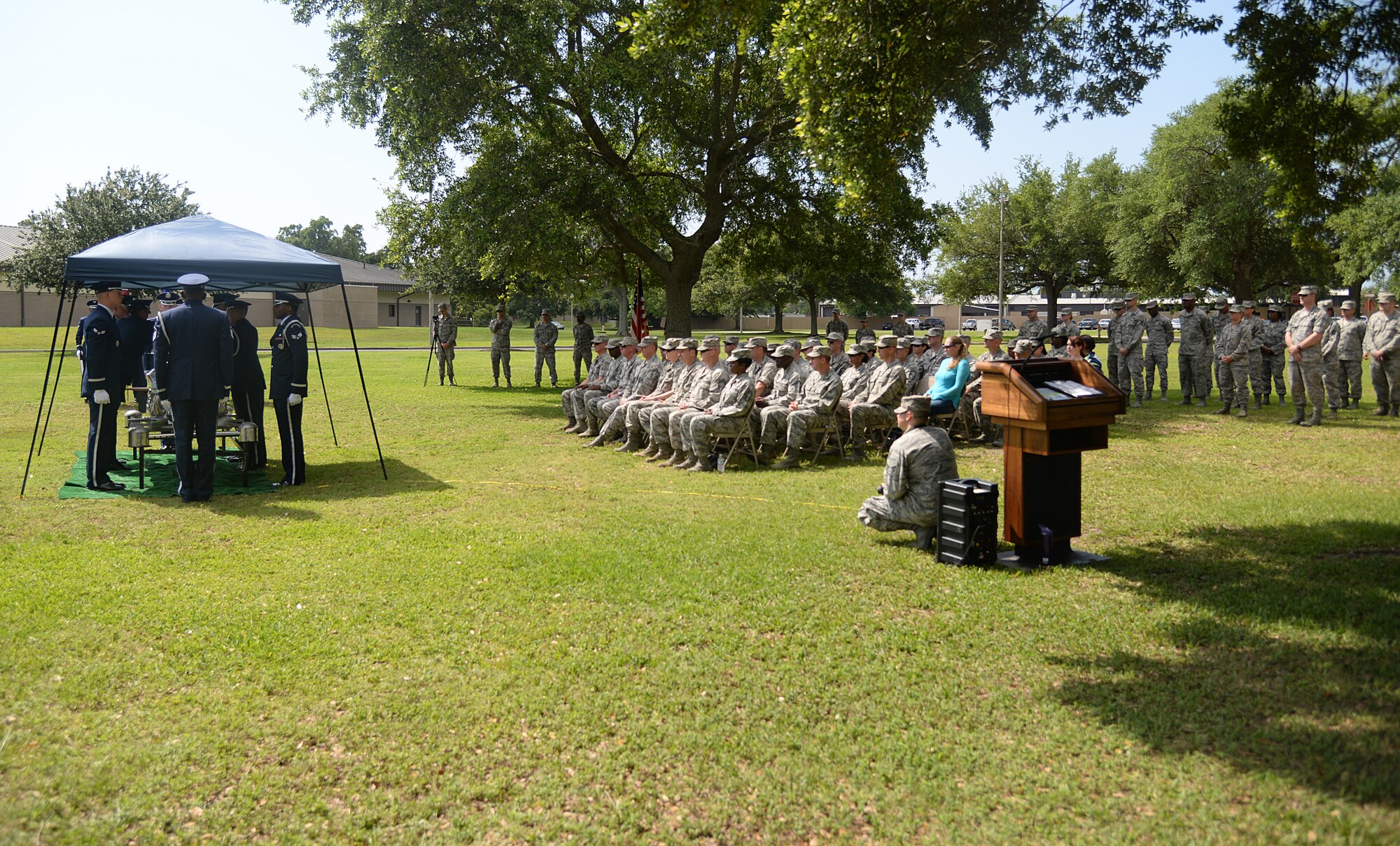 Leadership and family members watch honor guard members from Keesler and Columbus Air Force Bases, Miss., Maxwell AFB, Ala., and 159th Fighter Wing Louisiana Air National Guard participate in a mock active-duty funeral, May 20, 2015, at Keesler. Three members of the Air Force Honor Guard Mobile Training Team conducted a seven-day training course for honor guard members that covered firing party, flag presentations and pallbearer duties. (U.S. Air Force photo by Senior Airman Holly Mansfield)
