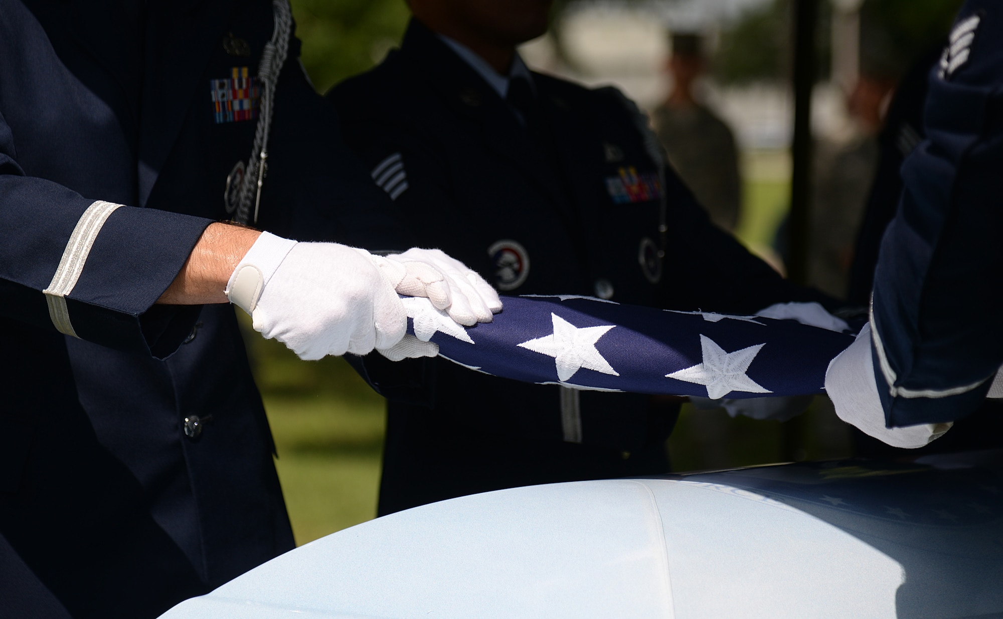 Honor guard pallbearers fold the American flag during a mock active-duty funeral, May 20, 2015, at Keesler Air Force Base, Miss. Three members of the Air Force Honor Guard Mobile Training Team conducted a seven-day course for honor guard members from Keesler, Columbus AFB, Miss., Maxwell AFB, Ala., and the 159th Fighter Wing Louisiana Air National Guard. Participants were trained on firing party, flag presentations and pallbearer duties. (U.S. Air Force photo by Senior Airman Holly Mansfield)