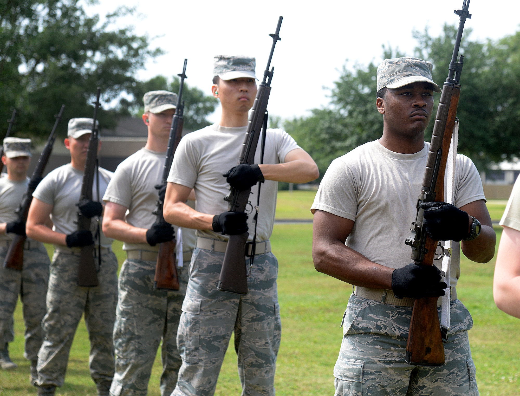 Honor guard members practice firing party techniques, May 13, 2015, at Keesler Air Force Base, Miss. Three members of the Air Force Honor Guard Mobile Training Team conducted a 7-day course for members of the Keesler, Columbus, Maxwell, Ala., and the 159th Fighter Wing Louisiana Air National Guard base honor guards. During the training participants were trained on firing party, flag presentations and pallbearer duties. (U.S. Air Force photo by Senior Airman Holly Mansfield)