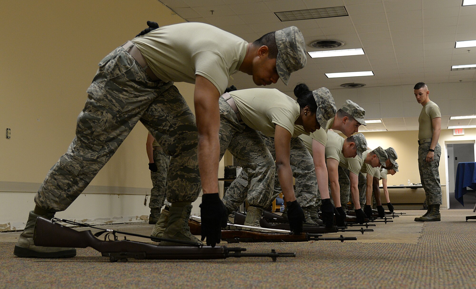 Airman 1st Class Mark Brownlee, Air Force Honor Guard Mobile Training Team instructor, observes honor guard members practicing firing party techniques, May 13, 2015, at Keesler Air Force Base, Miss. Three members of the mobile training team conducted a seven-day course for honor guard members from Keesler, Columbus AFB, Miss., Maxwell AFB, Ala., and the 159th Fighter Wing Louisiana Air National Guard. Participants were trained on firing party, flag presentations and pallbearer duties. (U.S. Air Force photo by Senior Airman Holly Mansfield)