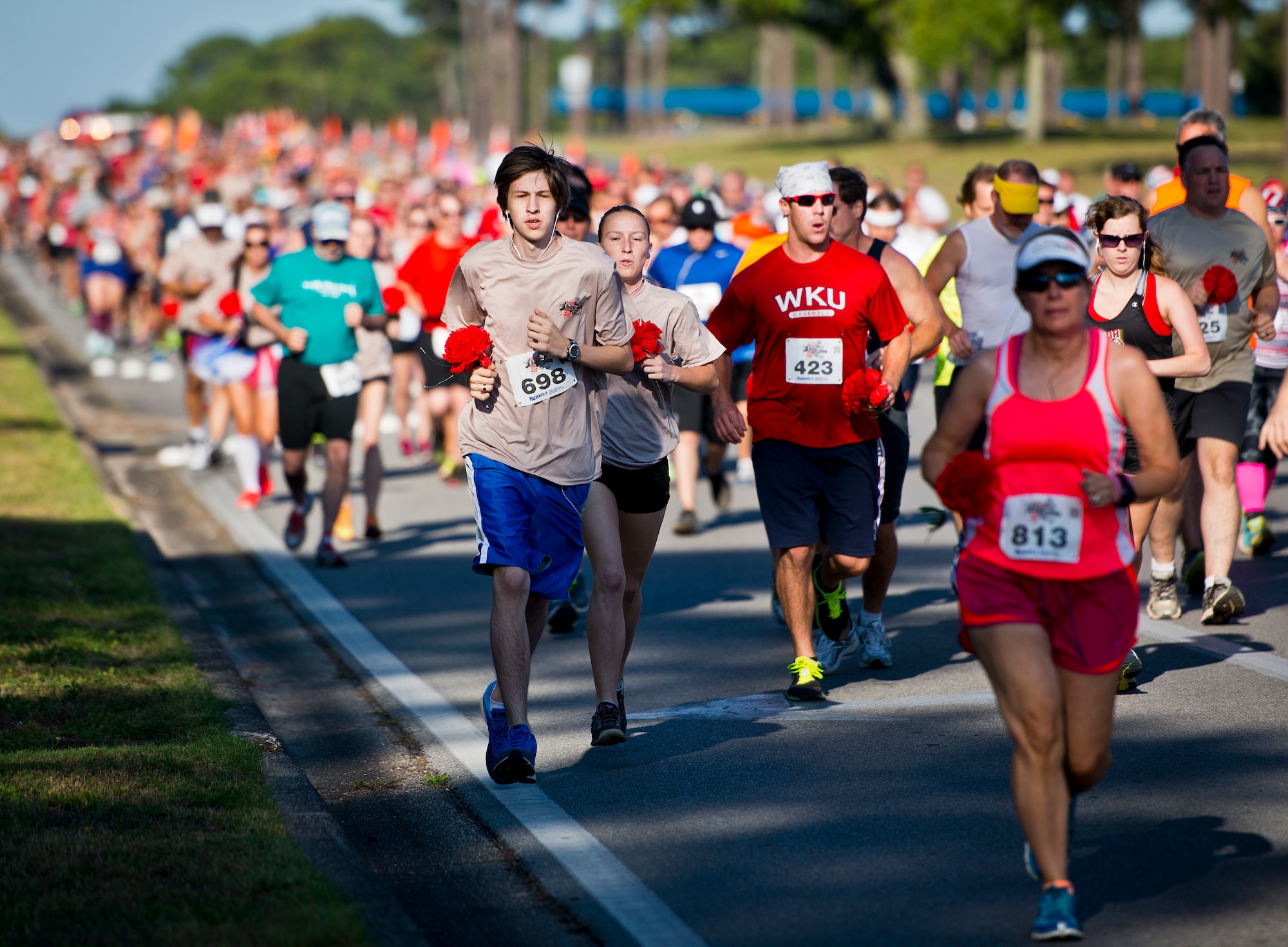 Hundreds of runners begin the long leg of Eglin Boulevardduring the 30th Anniversary Memorial Gate to Gate run May 23 at Eglin Air Force Base, Fla.  More than 1,500 participated in this year’s event.  (U.S. Air Force photo/Samuel King Jr.)