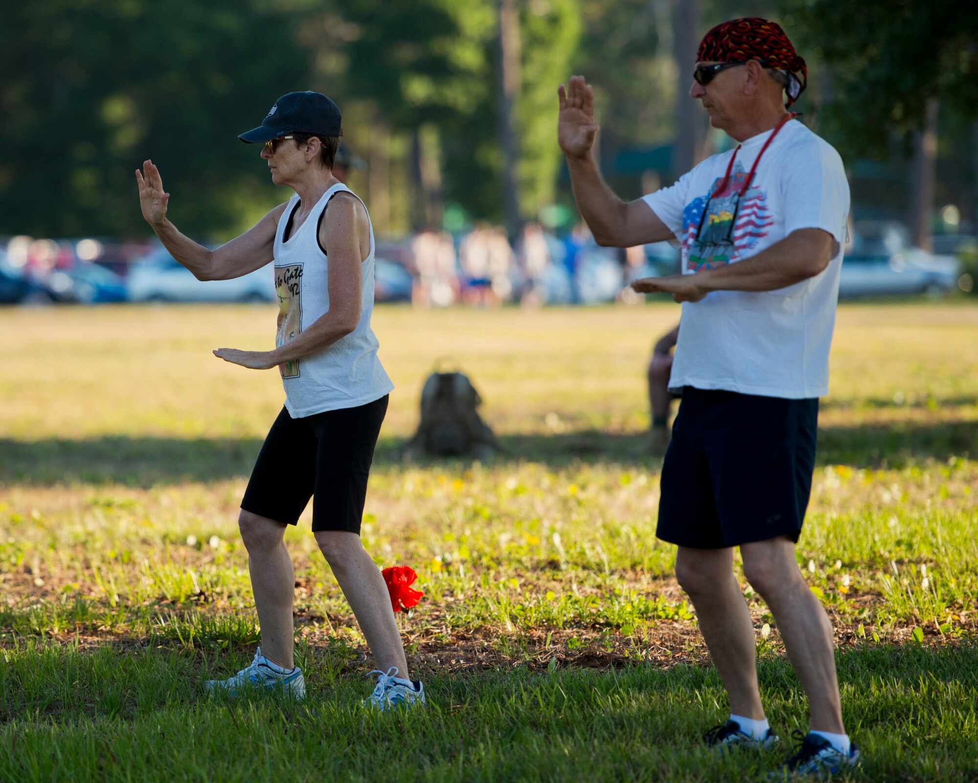 A couple performs tai chi to prepare for the 30th Anniversary Memorial Gate to Gate run May 23 at Eglin Air Force Base, Fla.  More than 1,500 participated in this year’s event.  (U.S. Air Force photo/Samuel King Jr.)